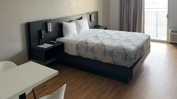 Desk, laptop workspace, blackout drapes, iron/ironing board