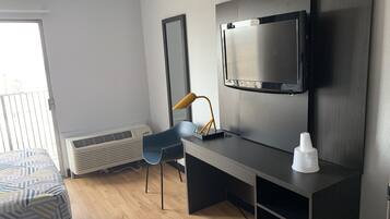 Desk, laptop workspace, blackout curtains, iron/ironing board