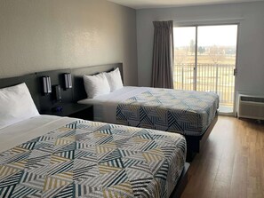 Deluxe Room, 2 Double Beds, Non Smoking, Kitchenette | Desk, laptop workspace, blackout drapes, iron/ironing board - Studio 6 Lincoln, NE - Airport (Lincoln)