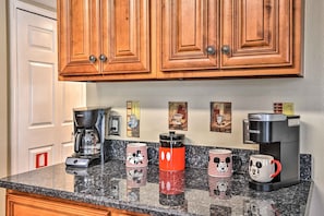 Enjoy cooking and brewing in this well-equipped kitchen with a granite countertop and convenient coffee makers.