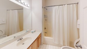 Bathtub, hair dryer, towels