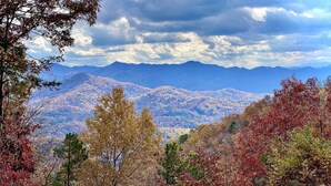 A view of a mountain range with autumn foliage. - Mountain Time | Scenic Views, Hot Tub, Wi-Fi, & Shuffleboard (Bryson City)