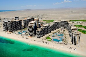 On the beach, sun-loungers, beach towels
