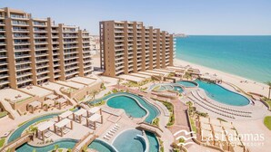 A resort with multiple high-rise buildings, a large pool area, and a beach. - 2 Kings plus Bunk Bed Room 3rd floor Huge Patio (Puerto Penasco)