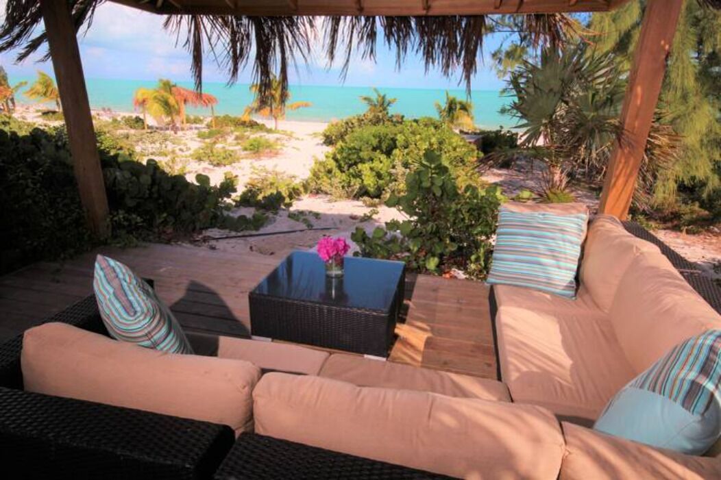 Indulge in the incredible beach view from our Tiki Hut