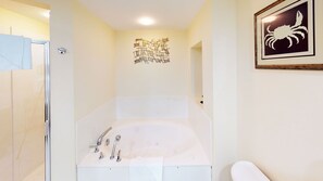 Shower, jetted tub, towels