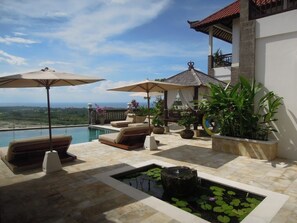 An infinity pool, sun loungers
