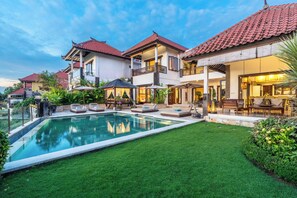 An infinity pool, pool loungers