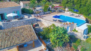 A stone villa with a swimming pool, outdoor seating, and a garden. - Helona: Villa Estate, heated pool, stunning views, A/C (Kelia - Kassiopi)