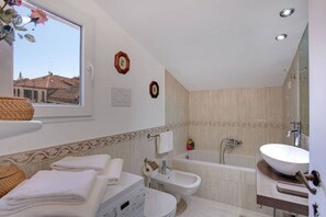 Combined shower/bathtub, hair dryer, bidet