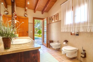 Shower, hair dryer, towels, toilet paper