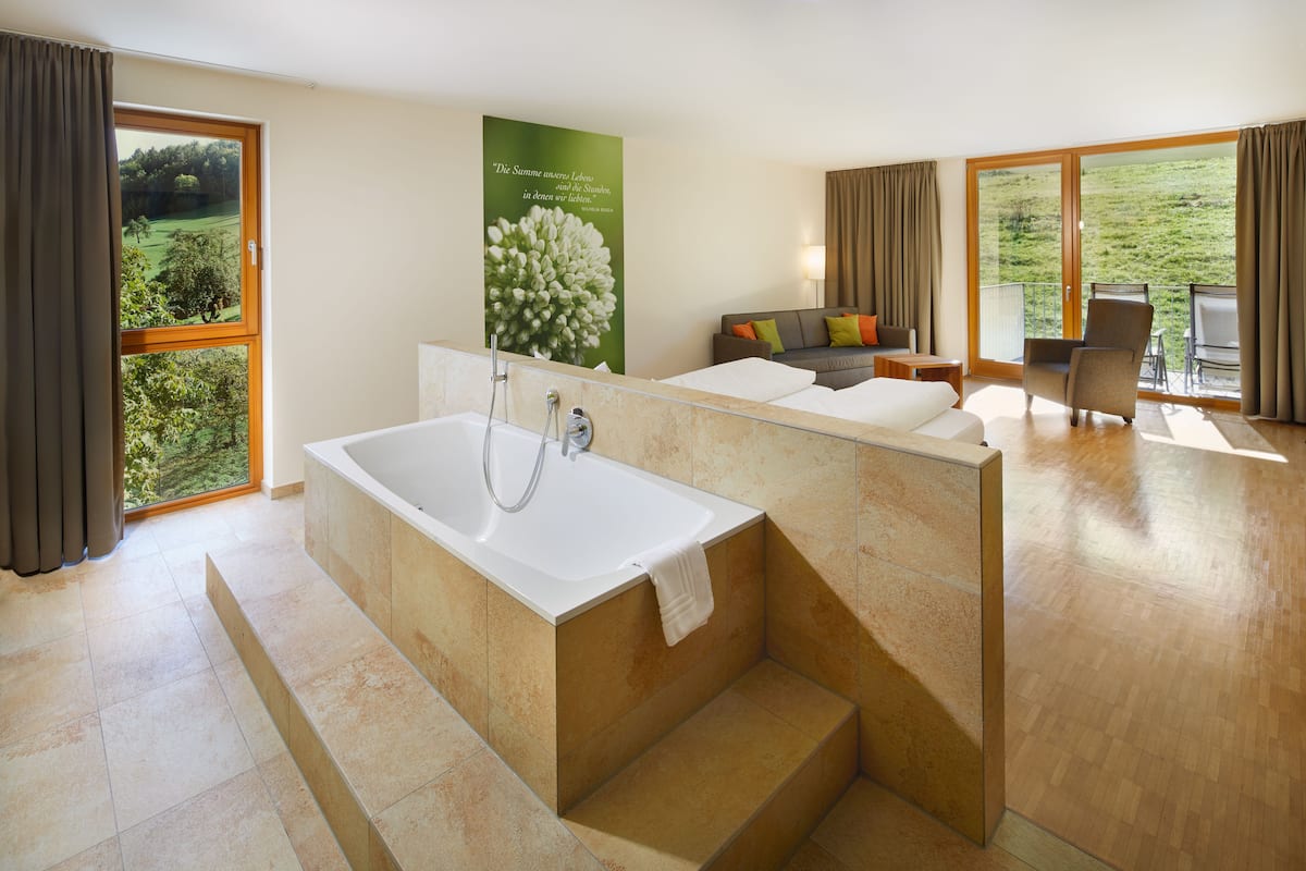 suite | bathroom | rainfall showerhead, hair dryer, bathrobes, towels