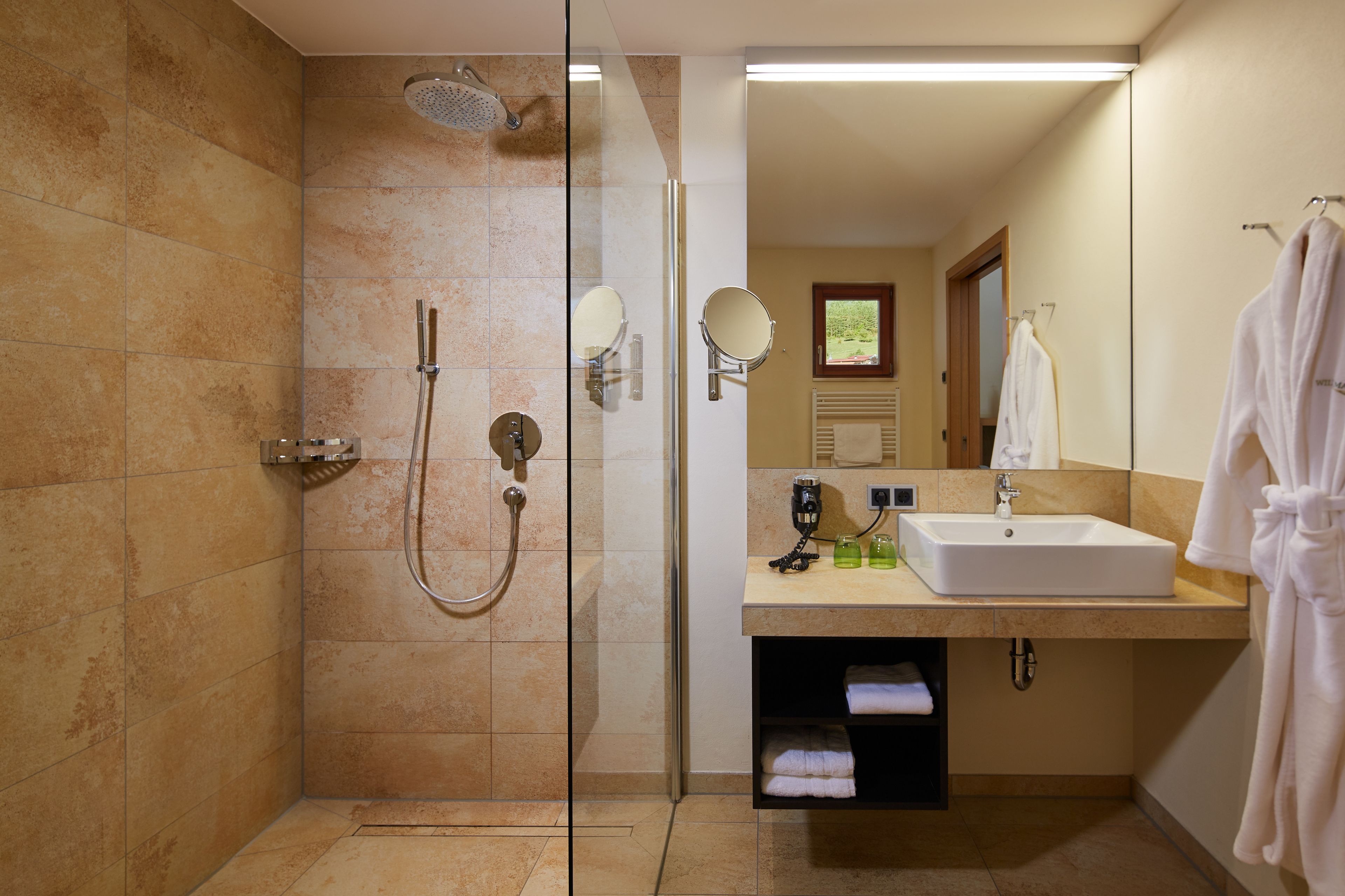 suite | bathroom | rainfall showerhead, hair dryer, bathrobes, towels