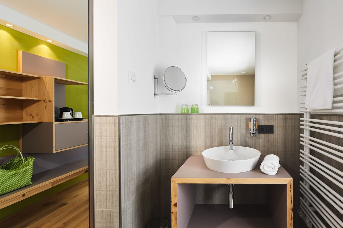 business double room | bathroom | rainfall showerhead, hair dryer, bathrobes, towels