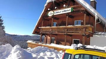 A wooden building with a sign reading 'Gasthof Salenhof.'