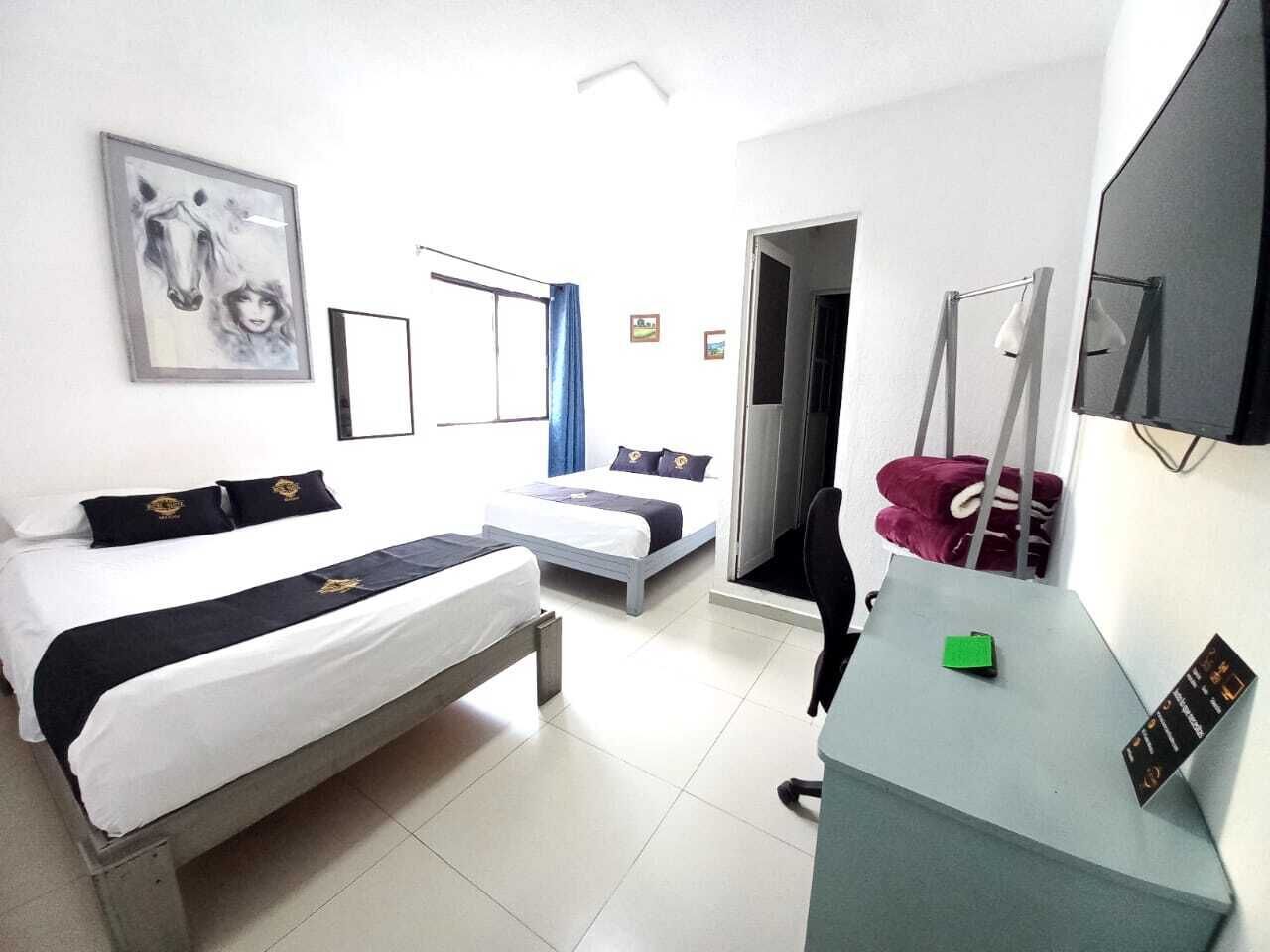 Hypo-allergenic bedding, desk, laptop workspace, blackout curtains