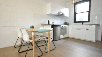 Standard Townhome | Private kitchenette | Fridge, microwave, stovetop, electric kettle
