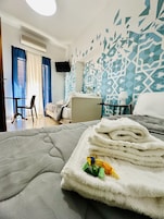 Comfort Twin Room, City View (Carmine) | Minibar, individually decorated, desk, blackout drapes