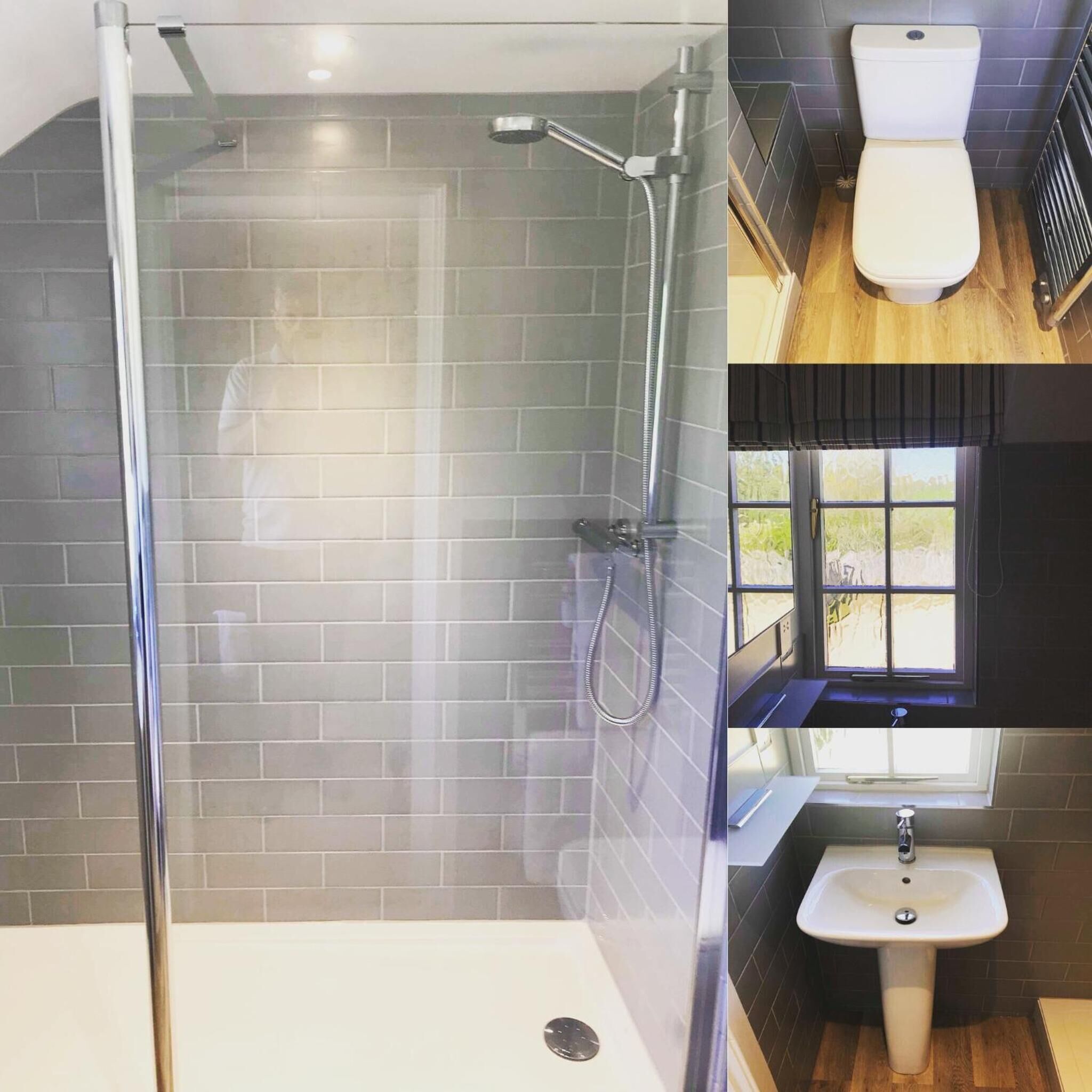 A bathroom with a glass-enclosed shower, a white toilet, and a sink.