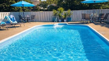 Seasonal outdoor pool, open 6:00 AM to 9:00 PM, pool umbrellas