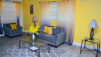 Apartment, Accessible, Private Bathroom | Living room | Flat-screen TV