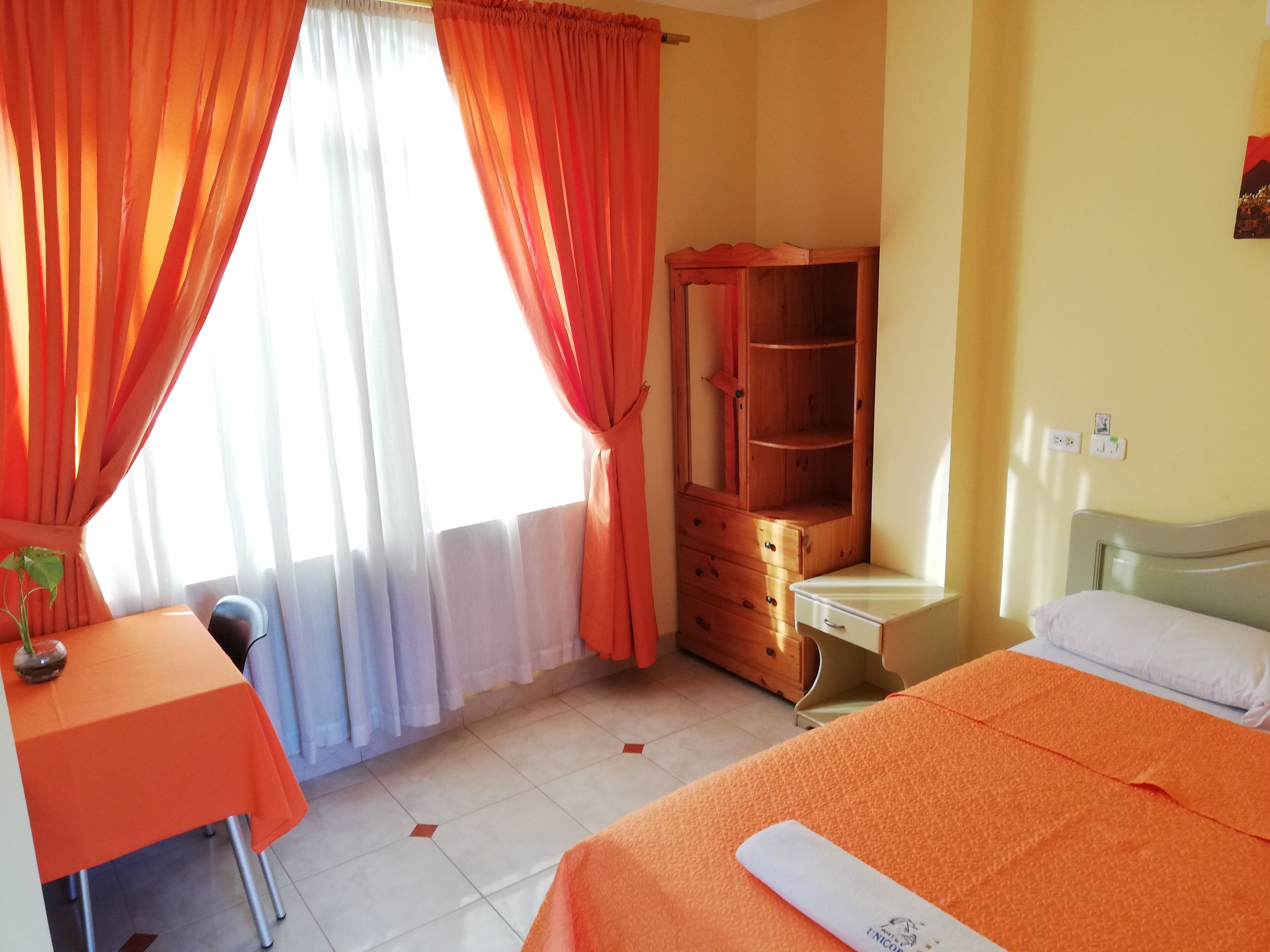 Premium bedding, desk, laptop workspace, blackout curtains