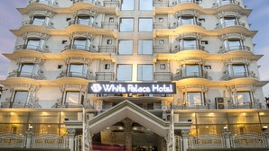 A multi-story hotel with a prominent sign reading "White Palace Hotel". - White Palace Hotel (Dhaka)