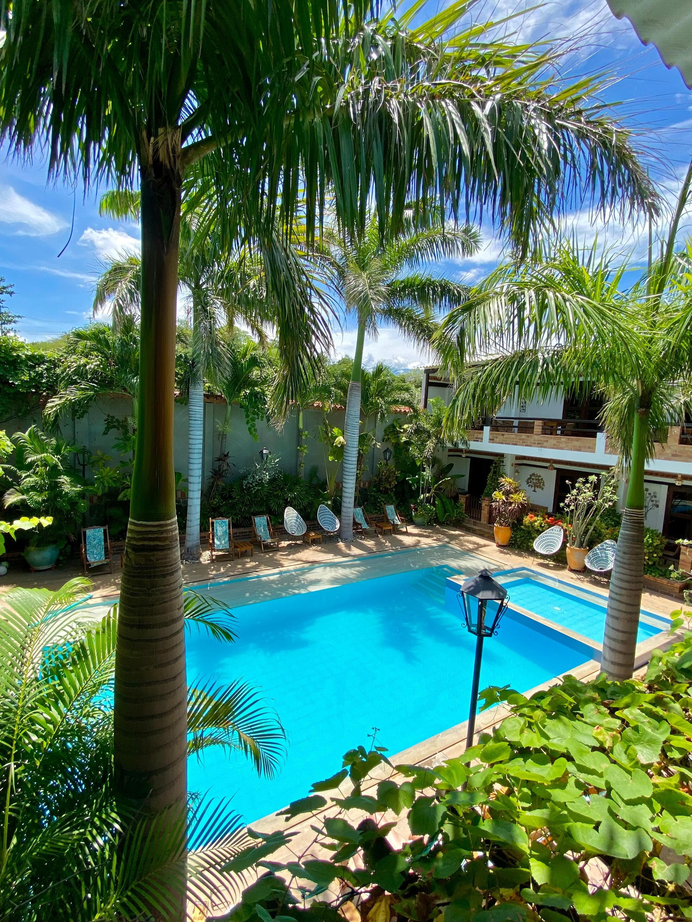 outdoor pool, open 8:30 am to 9:00 pm, pool loungers