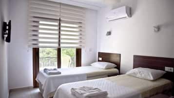 Standard Twin Room, Garden View | Minibar, rollaway beds, free WiFi, bed sheets