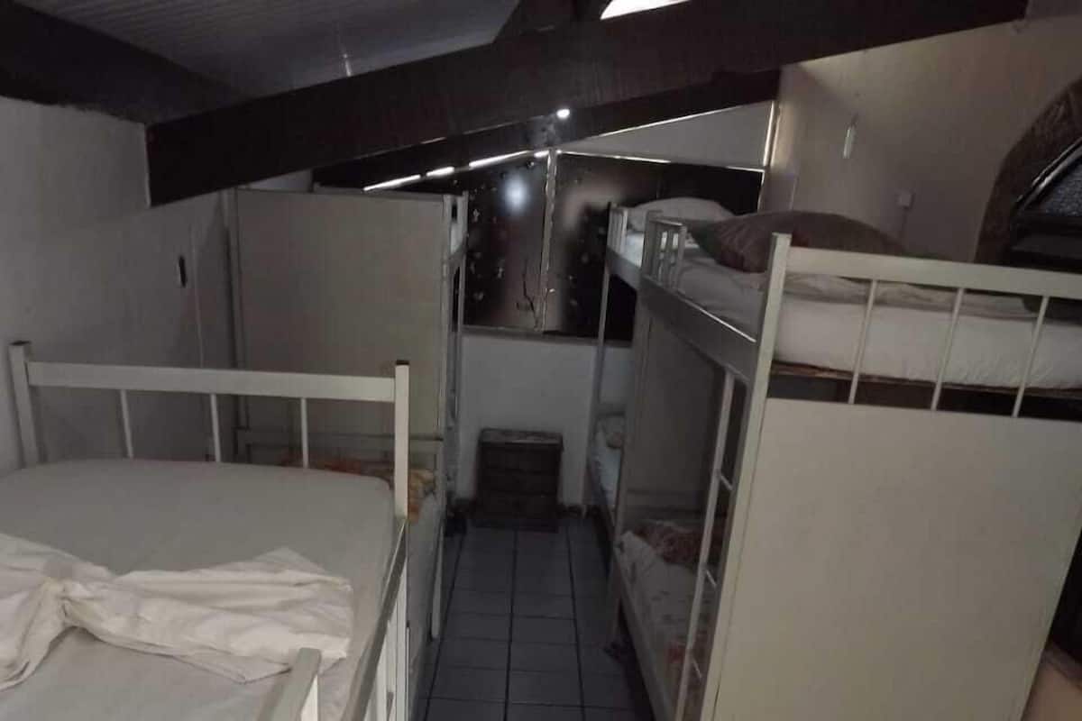 Shared Dormitory, Men only | Blackout drapes, iron/ironing board (on request), WiFi (free)