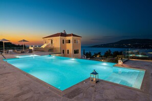 Seasonal outdoor pool, open 10:00 AM to 6:00 PM, pool umbrellas