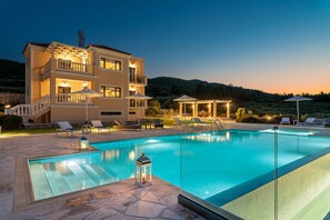 Seasonal outdoor pool, open 10:00 AM to 6:00 PM, pool umbrellas