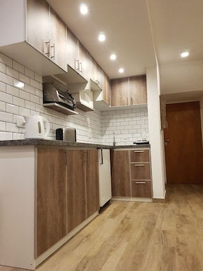 Apartamento, 2 habitaciones | Cocina privada | Frigorífico, horno, placa de cocina y cafetera o tetera