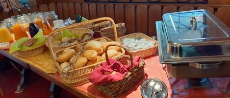 A breakfast buffet with various food items and beverages.