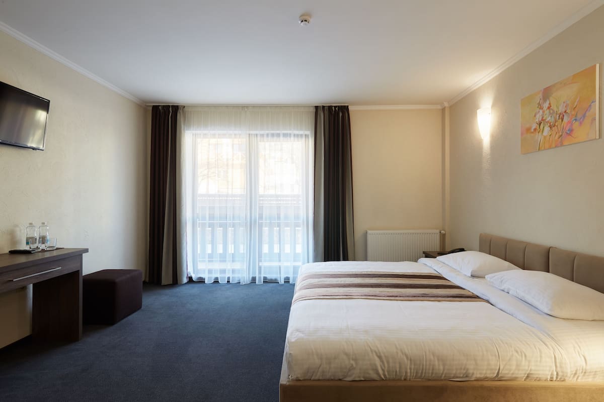 Junior Suite, Balcony | In-room safe, desk, soundproofing, iron/ironing board