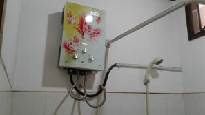 A control panel with a floral design, connected to a shower system. - Kota Bunga Q (Cipanas)