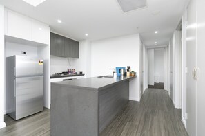 Comfort Apartment, 2 Bedrooms | Private kitchen | Full-size fridge, microwave, oven, stovetop