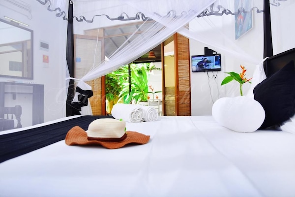 Deluxe Triple Room, Multiple Beds, Accessible, Garden View | Soundproofing, cribs (surcharge), individually decorated