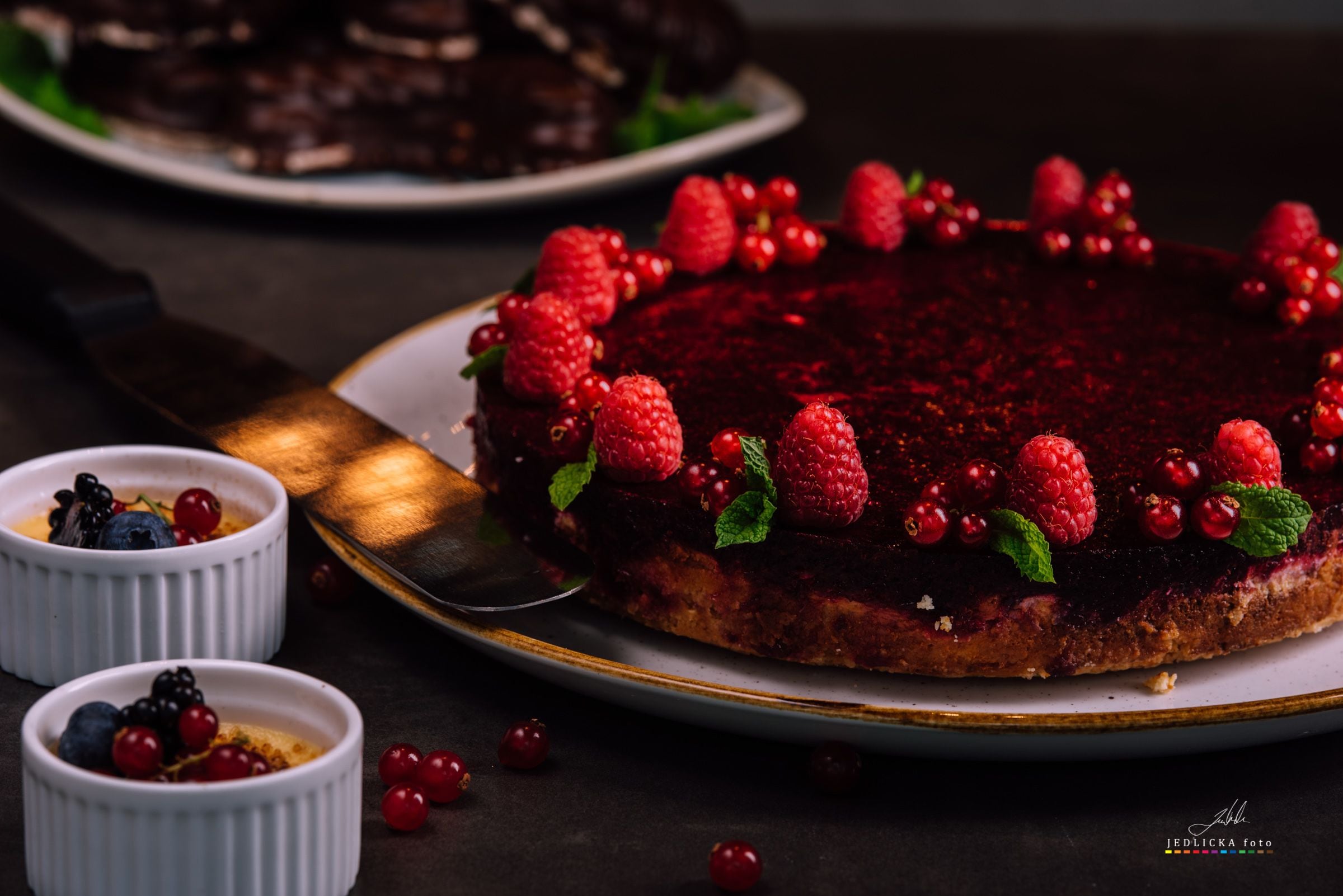 A dessert with raspberries and berries on a plate.