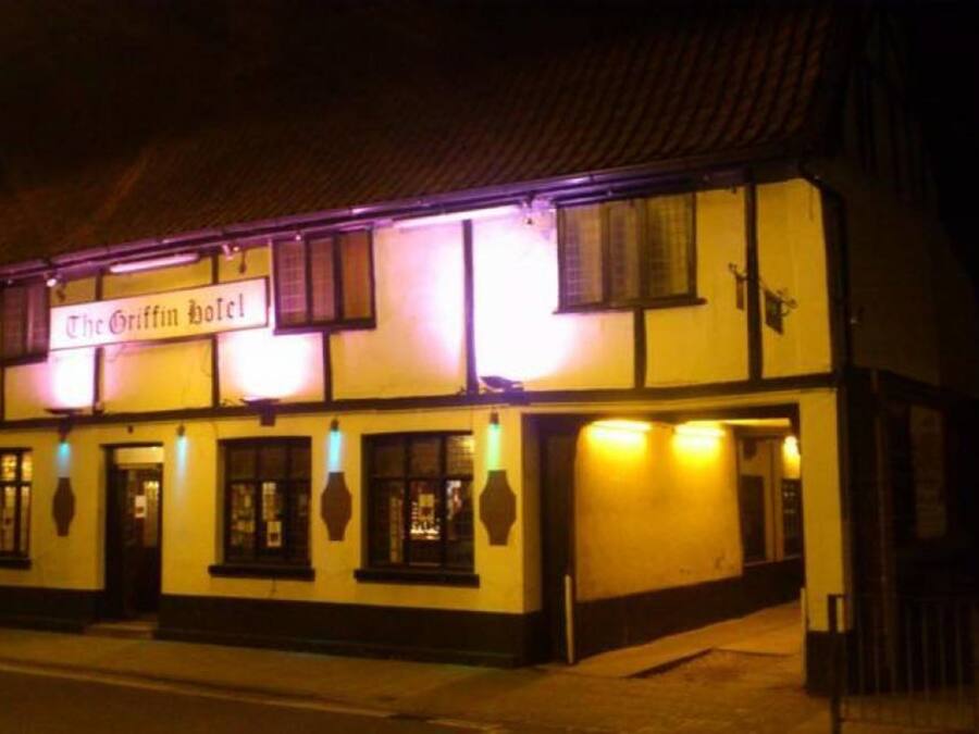 The Griffin Hotel with a traditional facade, multiple windows, and a signboard.