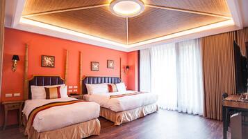 A hotel room with two beds, a wooden ceiling, and a large window with curtains.