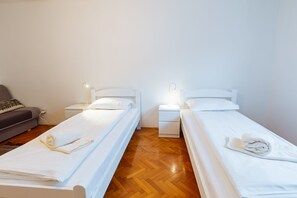 Standaard Twin kamer, gemeenschappelijke badkamer | Gratis wifi, beddengoed