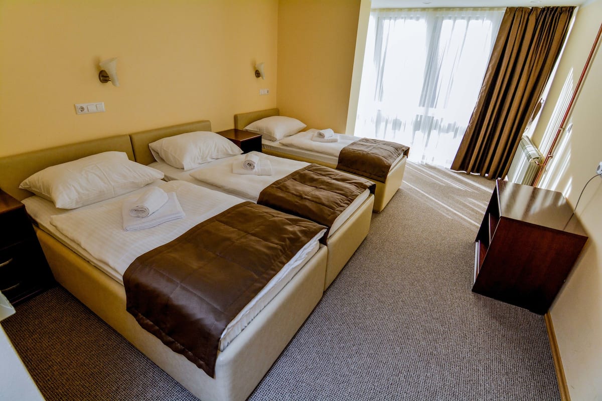 Triple Room | Hypo-allergenic bedding, minibar, in-room safe, blackout curtains