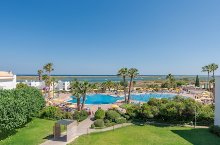 Indoor pool, 2 outdoor pools, open 10:00 AM to 7:00 PM, pool umbrellas