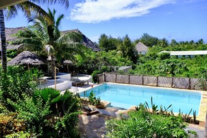 2 outdoor pools, open 9:00 AM to 9:00 PM, pool umbrellas, pool loungers