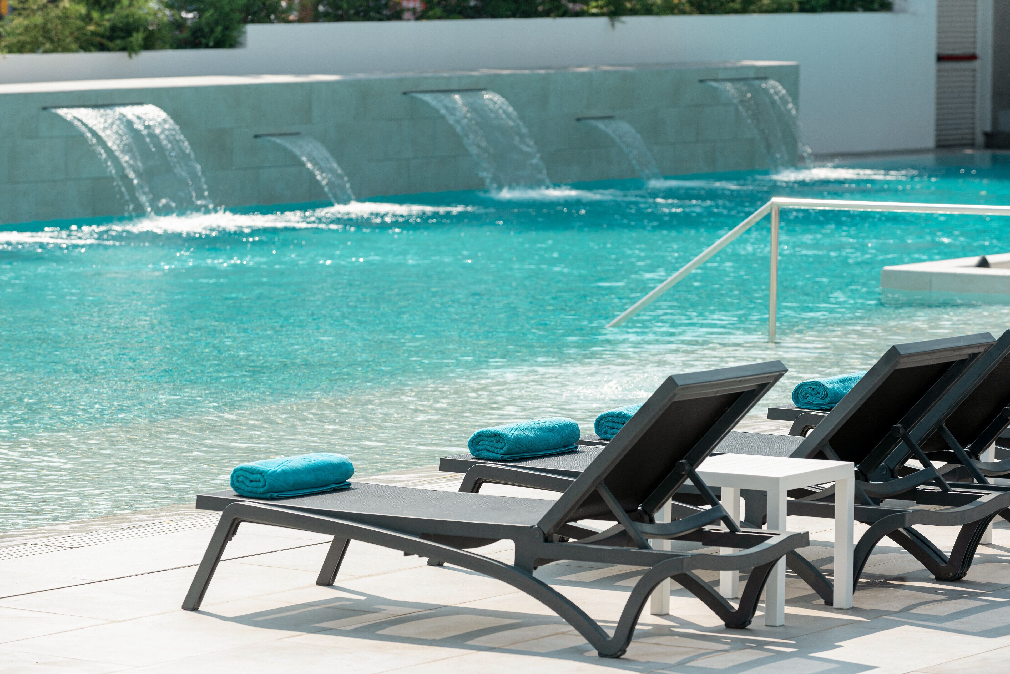 2 outdoor pools, pool umbrellas, pool loungers