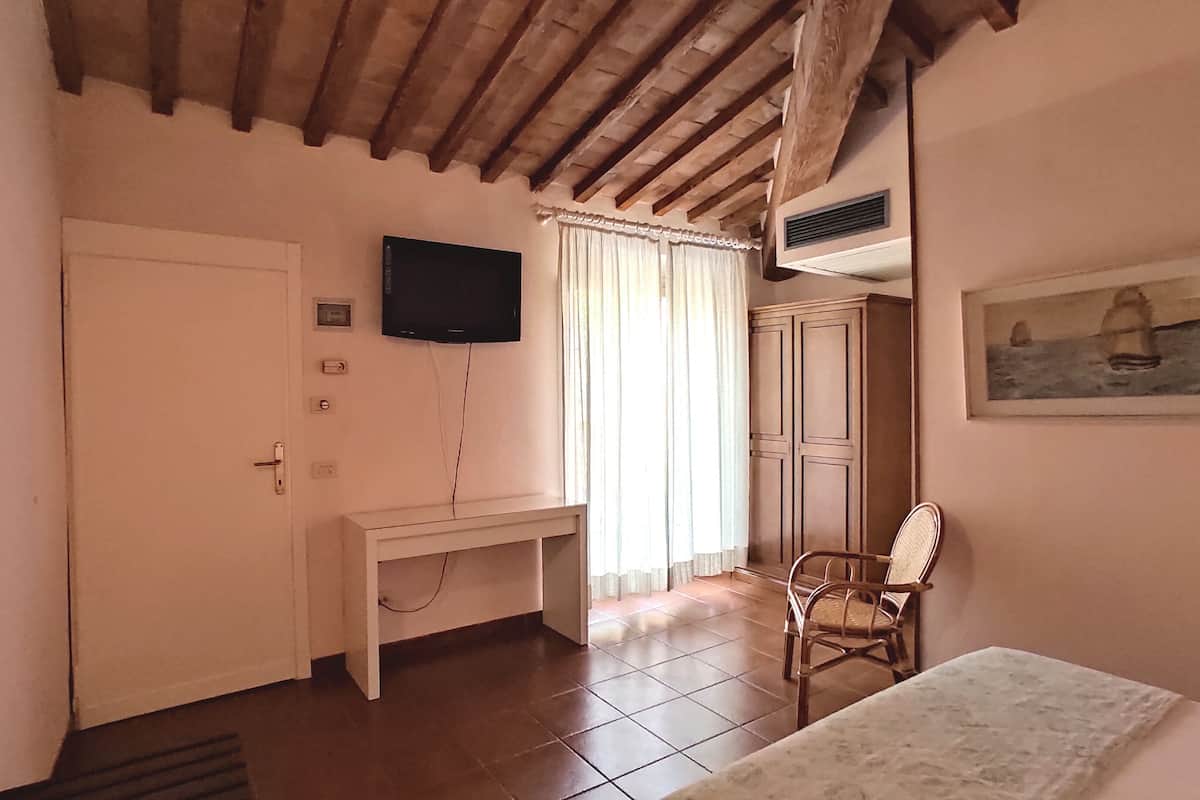 Economy Double Room, 1 Queen Bed, Garden View | Frette Italian sheets, premium bedding, Select Comfort beds, desk