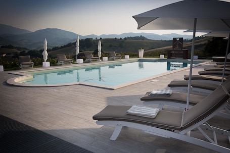 Seasonal outdoor pool, pool umbrellas, sun loungers