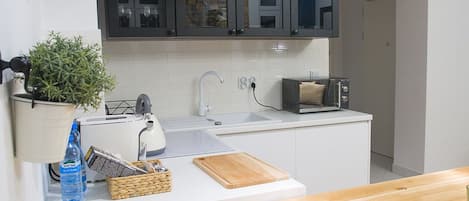 Departamento Deluxe | 1 habitación, tabla de planchar con plancha, wifi gratis y ropa de cama