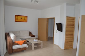 Basic Double Room | Living area | Flat-screen TV